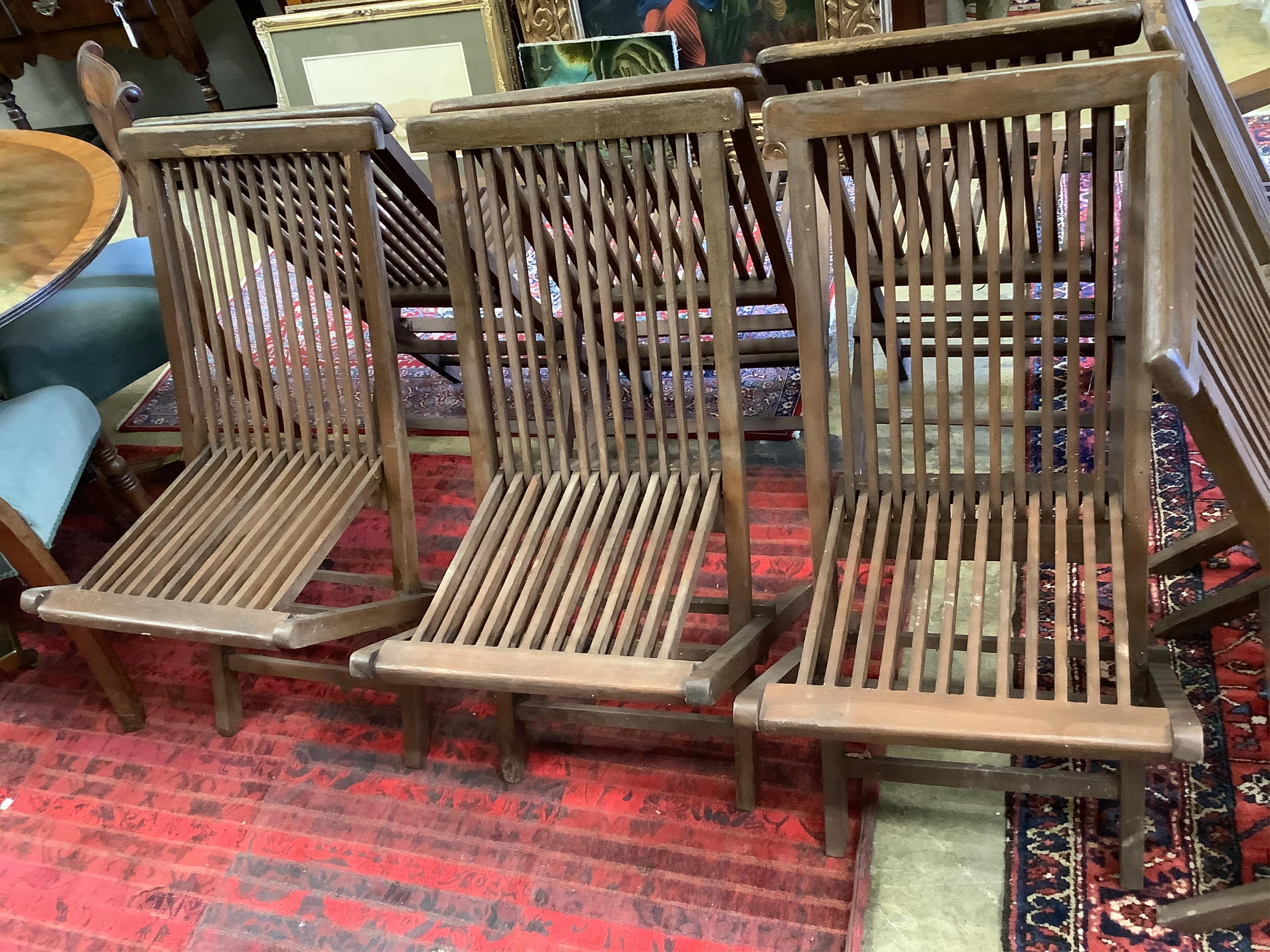 A set of eight teak folding garden chairs (two with arms)